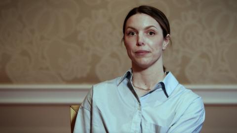 woman speaking to camera at an Acquia event